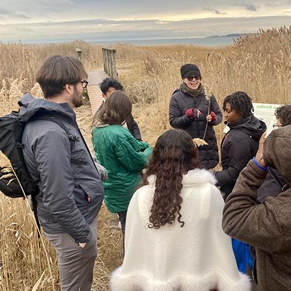 Amy Carlile, Ph.D. guiding students through the Long Wharf Nature Preserve.